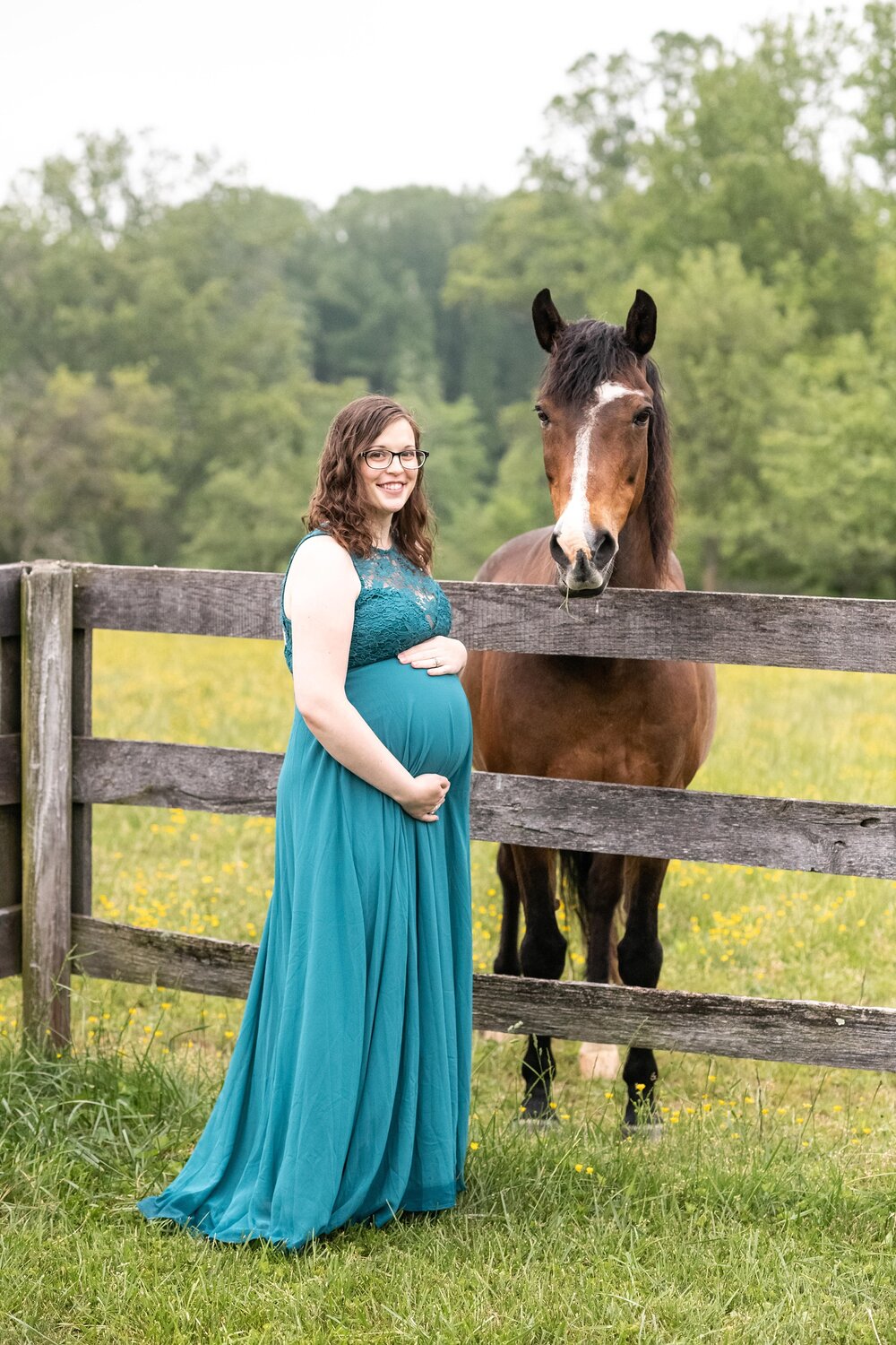 Frederick MD maternity portraits on a family farm near Lake Linganore by Wendy Zook Photography | expecting mother poses by horse on farm