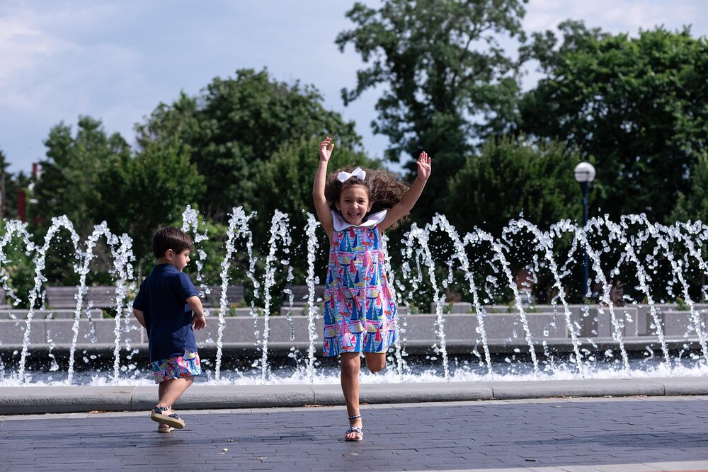 children run in front of downtown Frederick MD fountain