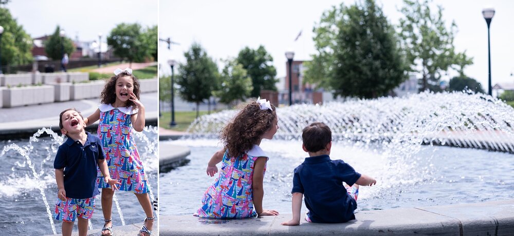 siblings play in downtown Frederick MD fountain photographed by Wendy Zook