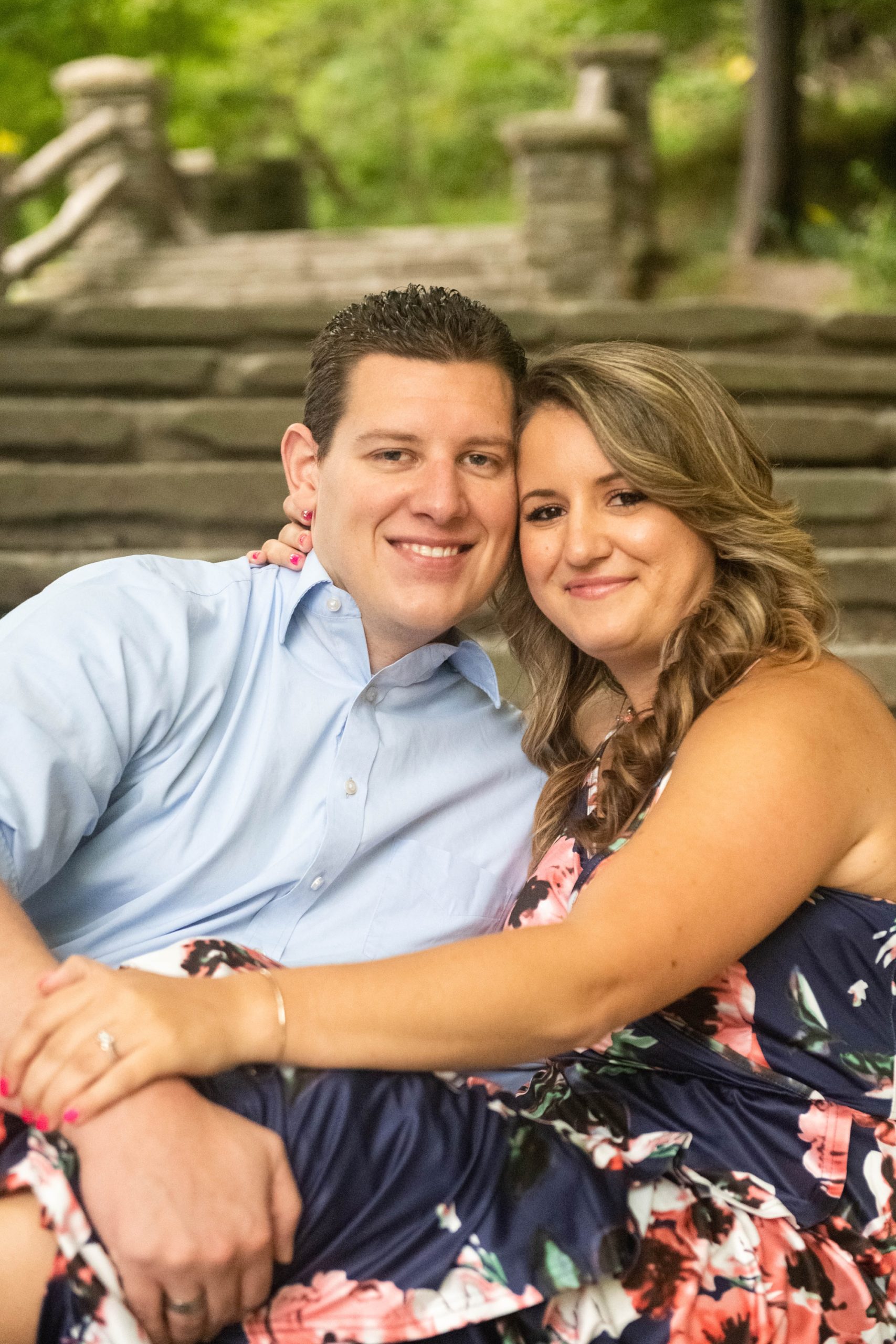 New York couple leans together during destination engagement session 