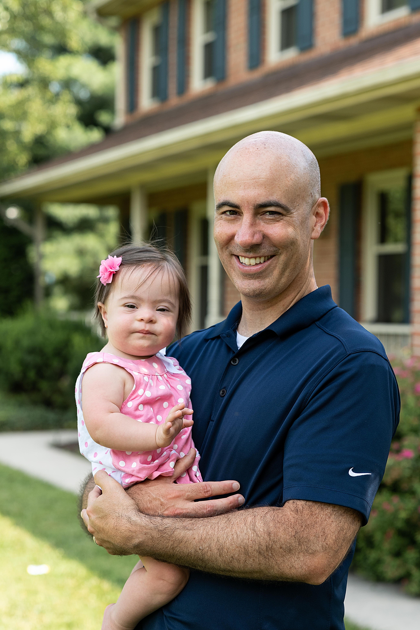 dad holds baby girl during Frederick MD family session