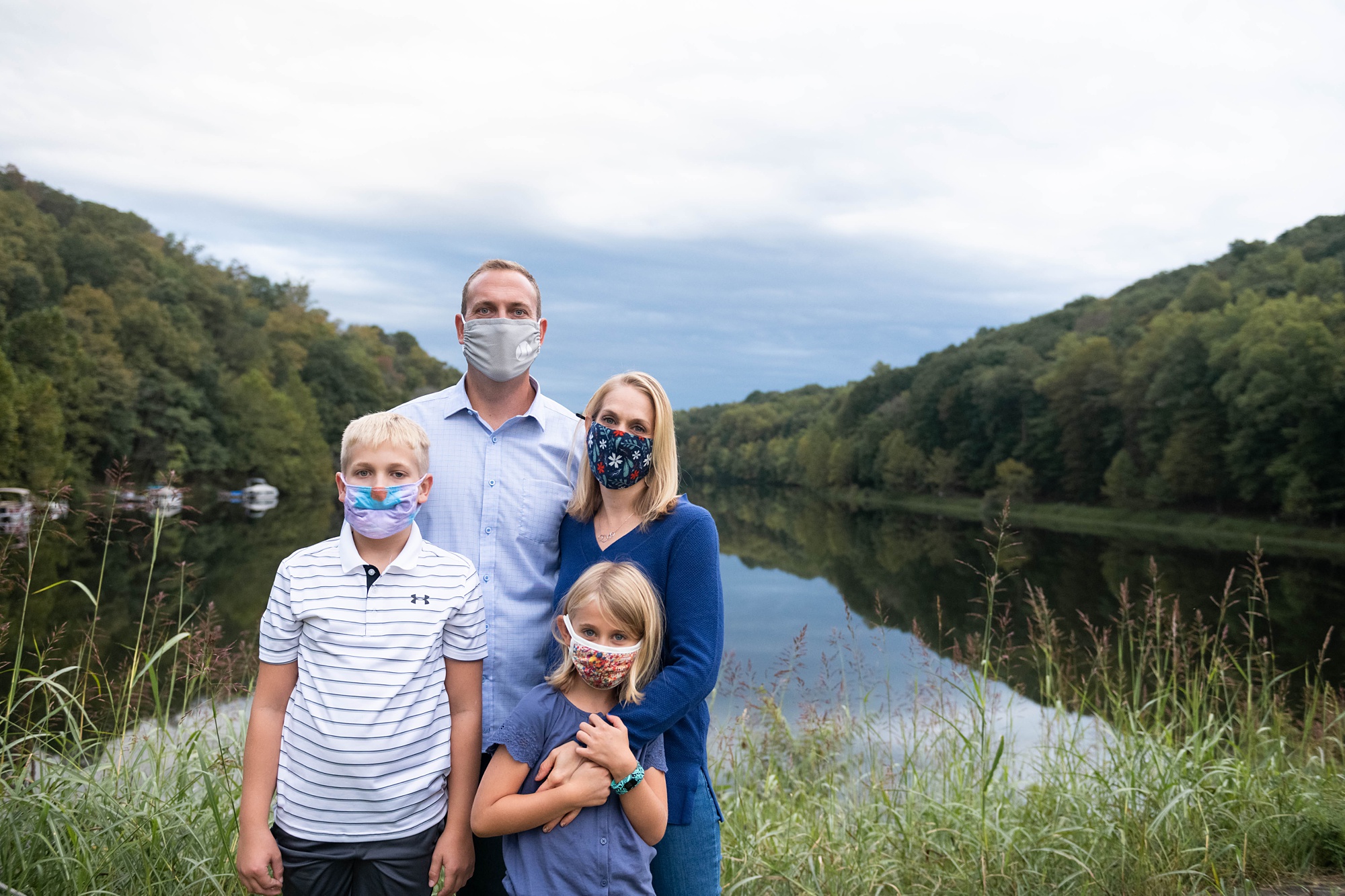 Maryland family poses with masks during Photo Session in Lake Linganore