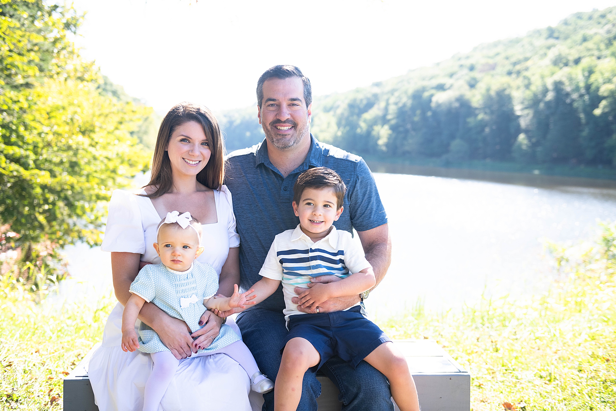 family of four poses in Frederick MD session