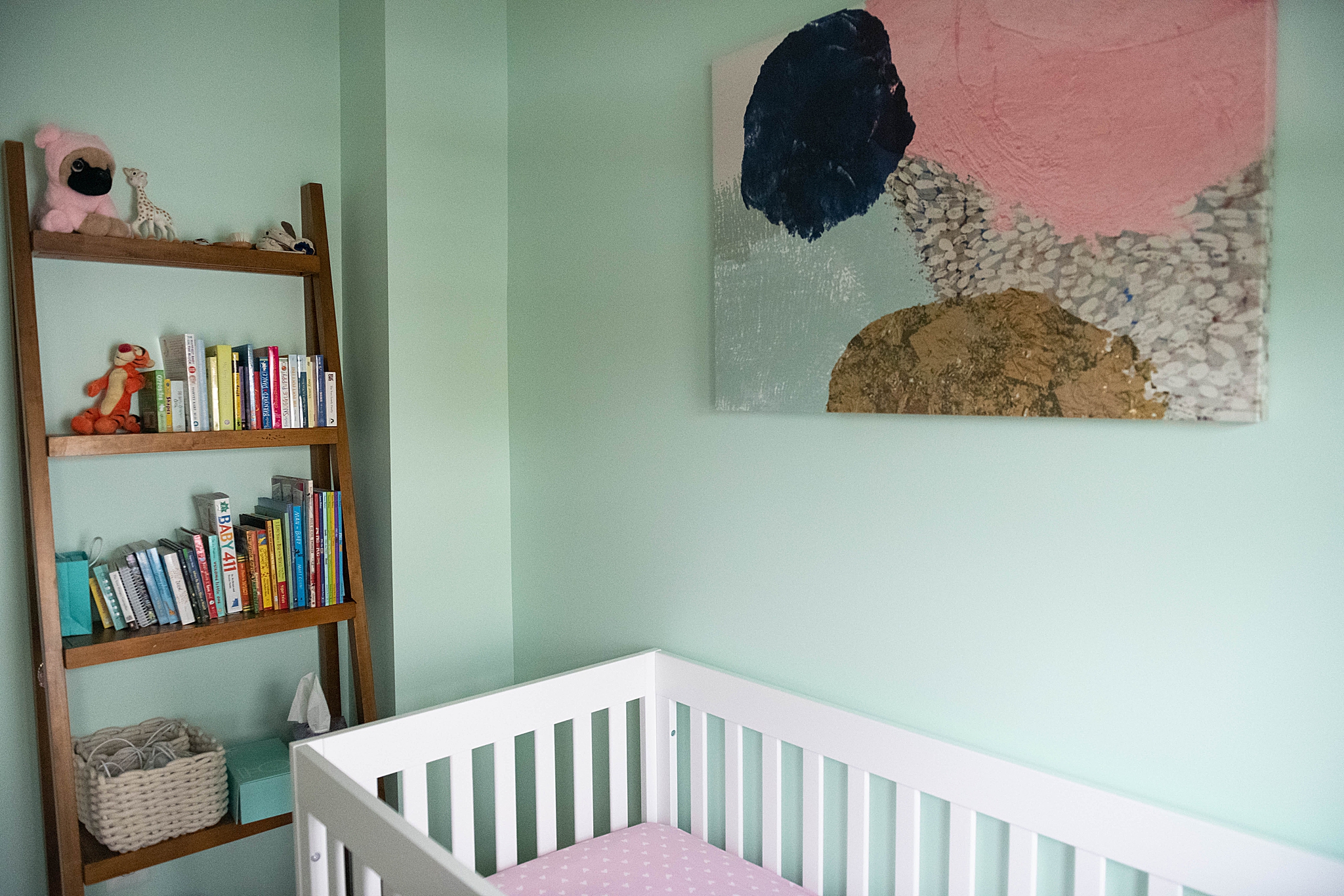 nursery with mint walls for baby girl