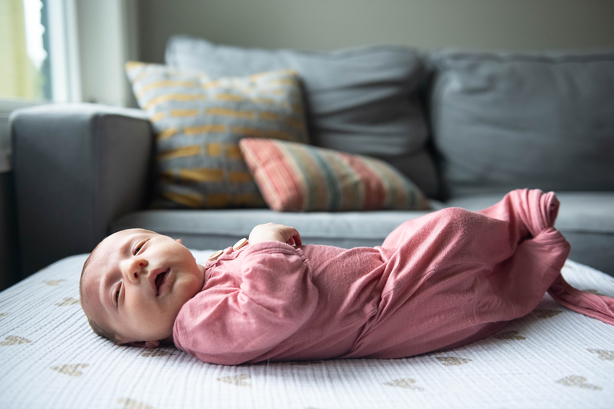 baby sleeps on couch during at home lifestyle session