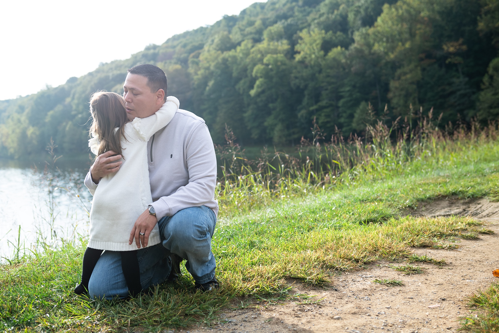 dad hugs daughter during family photos in Maryland