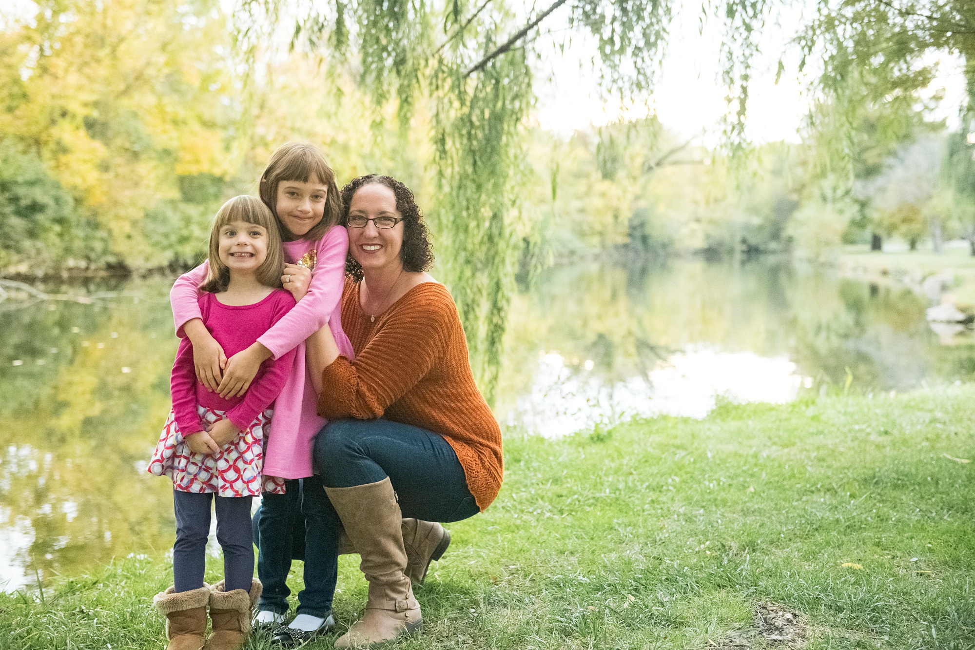 mom hugs daughter during Maryland family photos in the fall