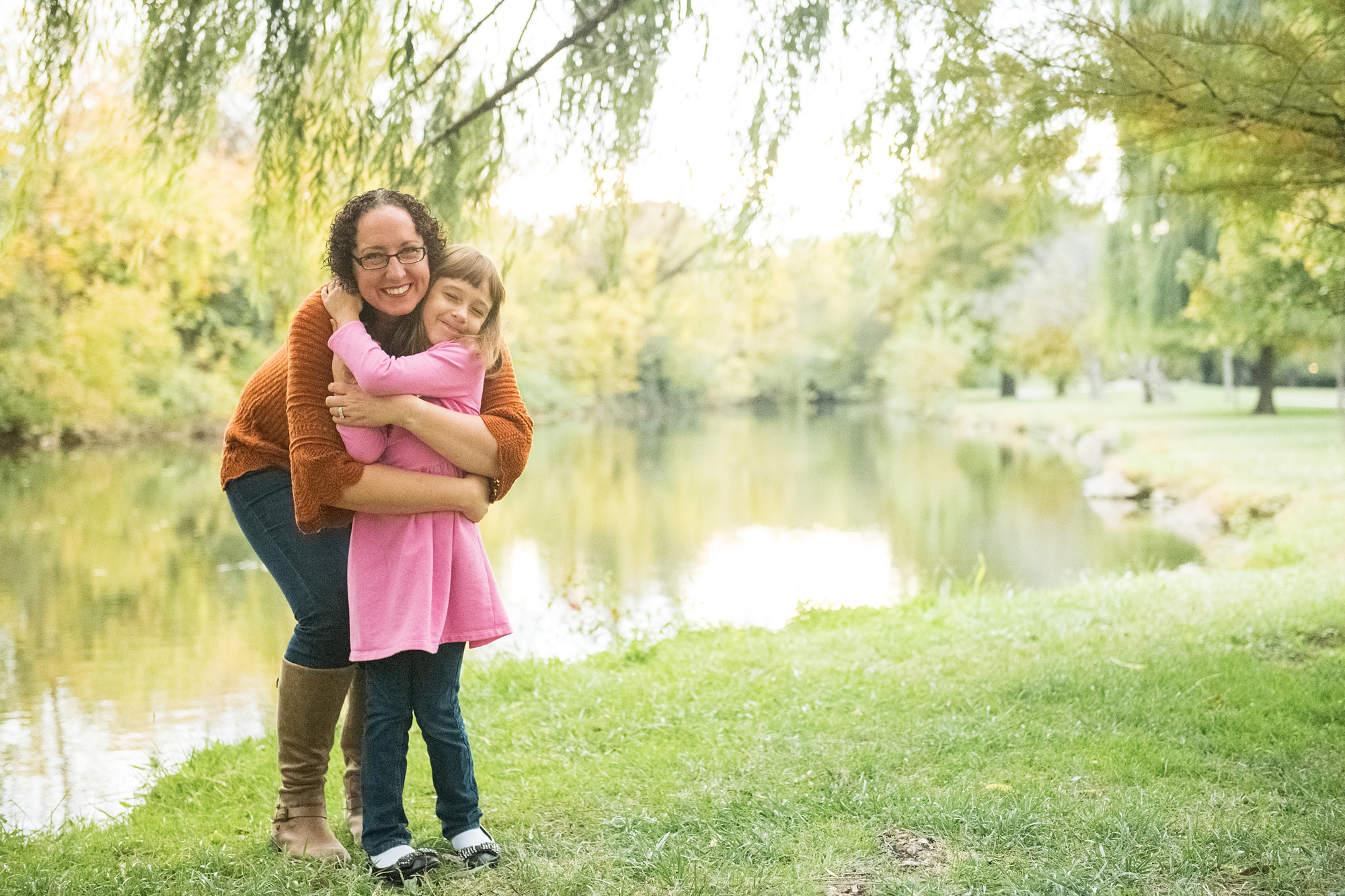 daughter hugs mom during MD family photos 