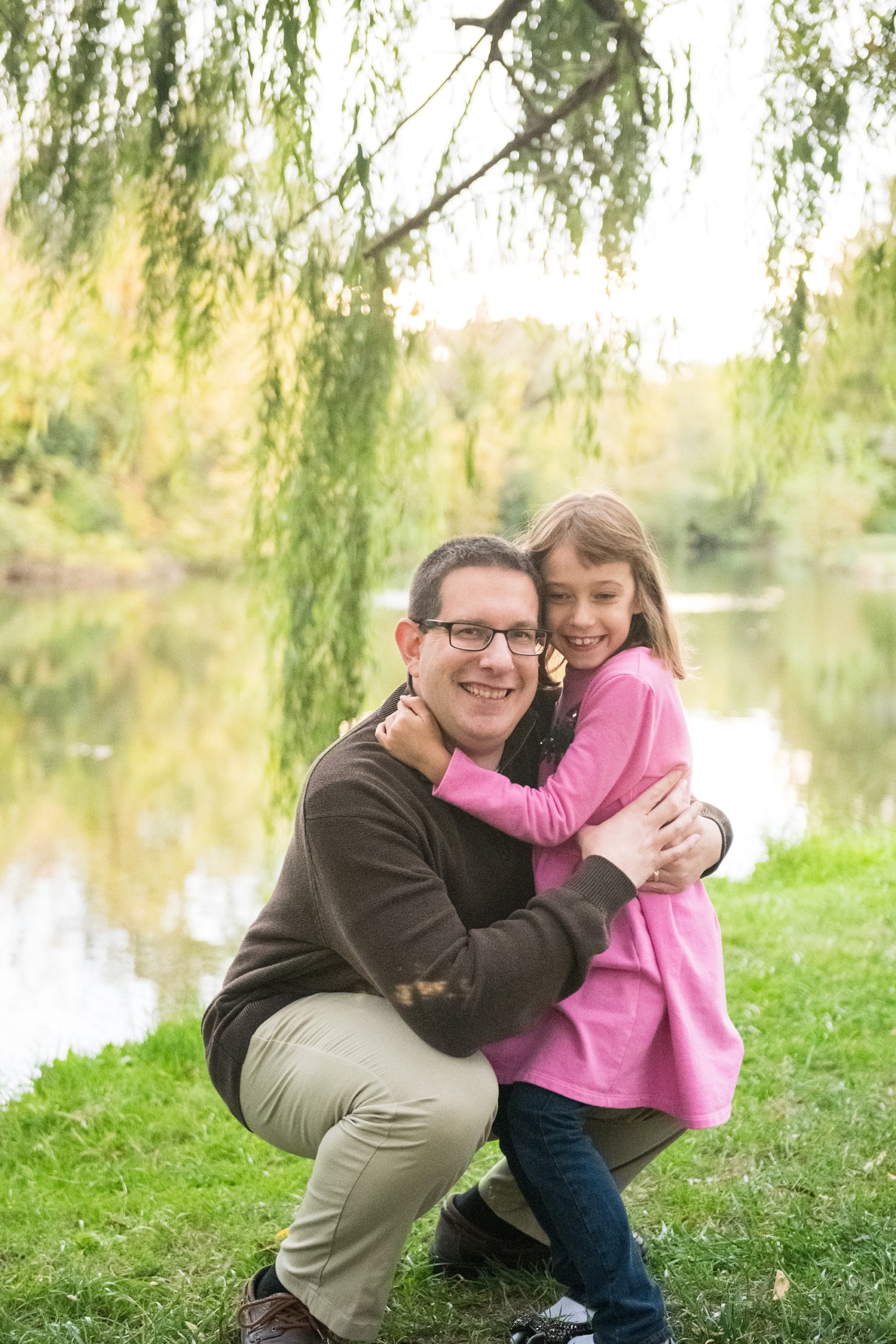 dad hugs daughter during Maryland family photos