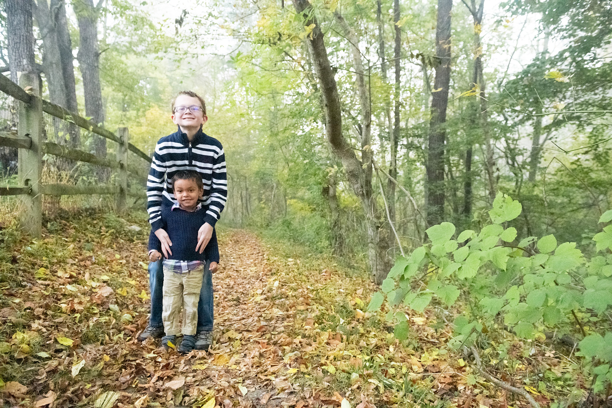 brothers pose on trail in Lake Linganore