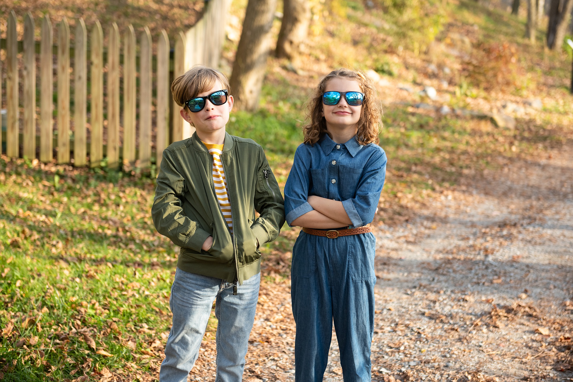 kids take funny photo with sunglasses during fall family photo session