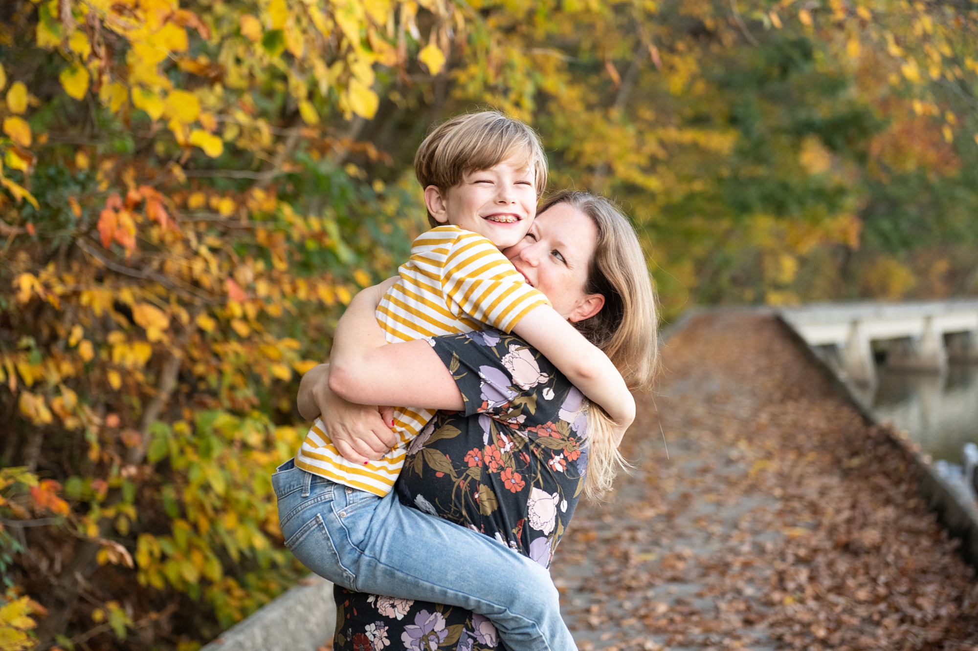 son hugs mom during family photos in Lake Linganore
